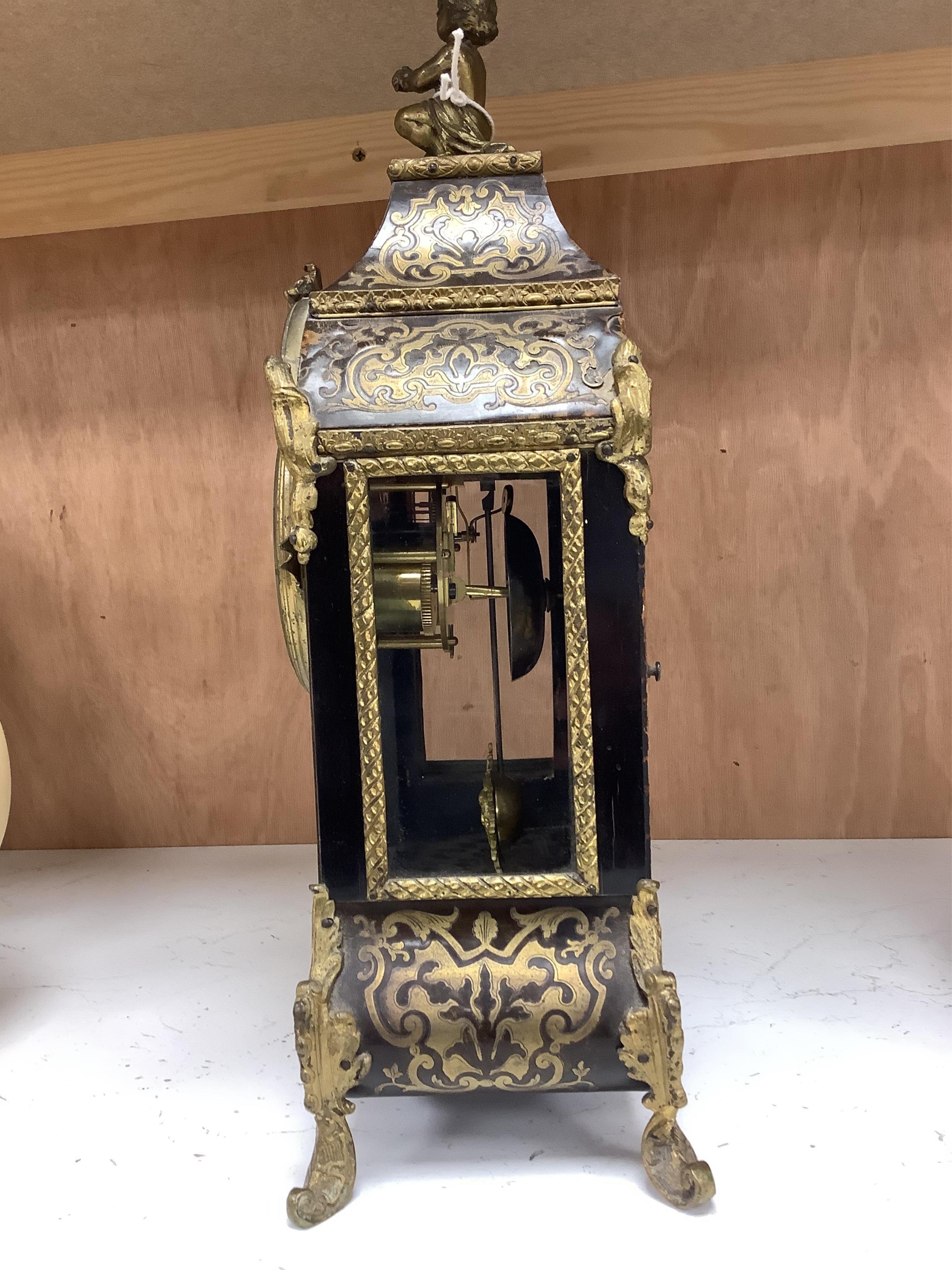 A late 19th century French boulle work mantel clock, with key and pendulum, 40cm. Condition - fair to good, generally worn, not tested as working